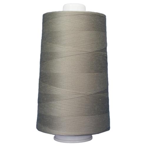 Large spool of gray thread on a white background