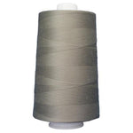 Large spool of gray thread on a white background