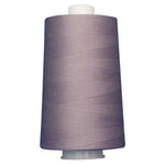 Large spool of purple thread on a white background