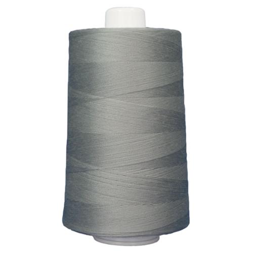 Spool of gray thread on a white background