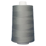 Spool of gray thread on a white background