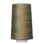 Spool of brown thread on a white background