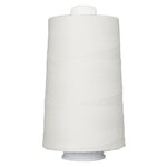 White spool of thread on a white background