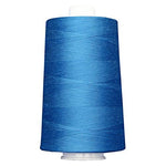 Blue spool of thread on a white background