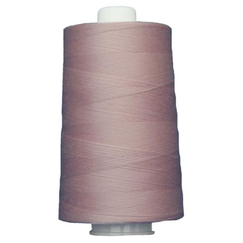 Spool of purple thread on a white background