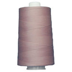 Spool of purple thread on a white background