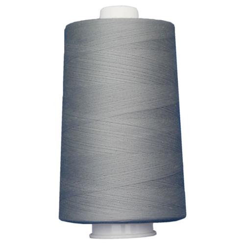 Large spool of gray thread on a white background
