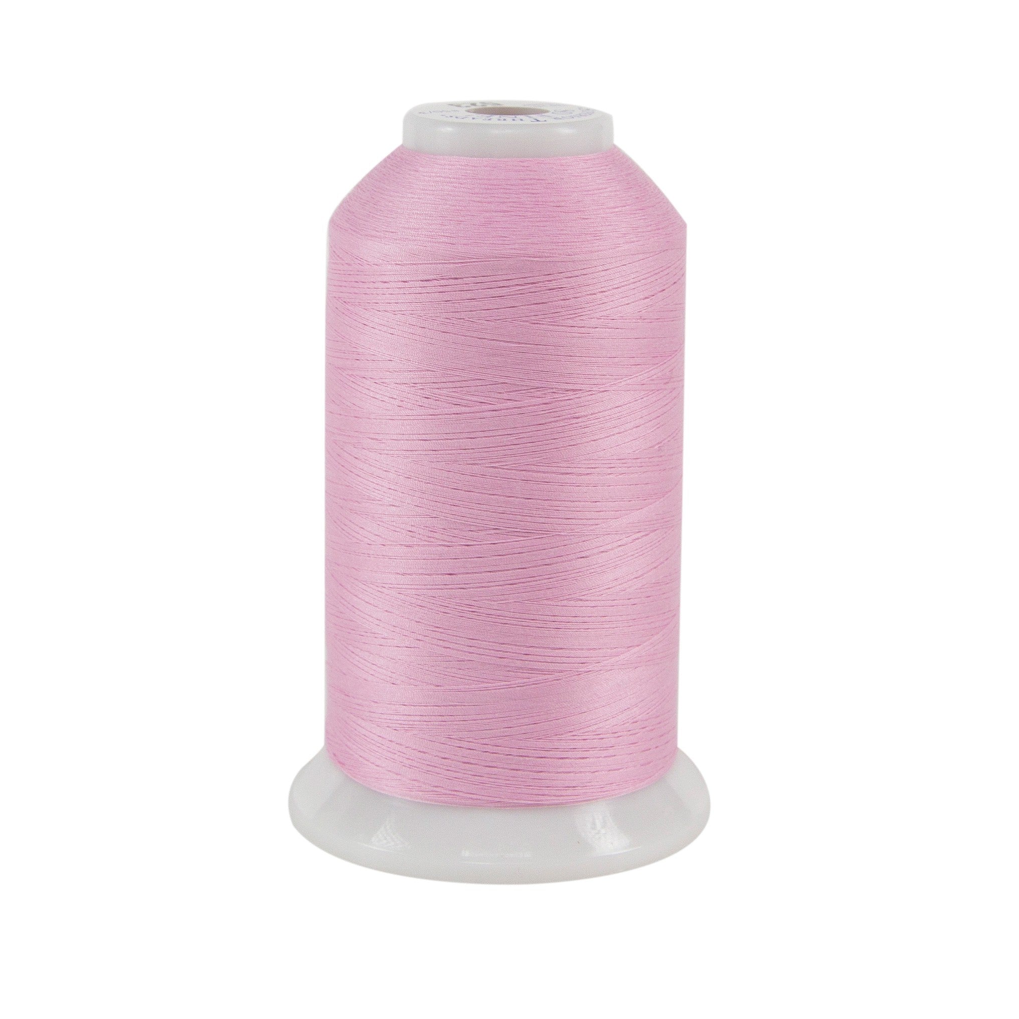 A spool of pink thread on a white background