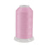 A spool of pink thread on a white background