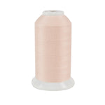Light peach thread on a white background