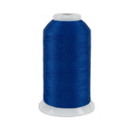 Spool of blue thread on a white background