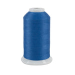 Spool of blue thread on a white background
