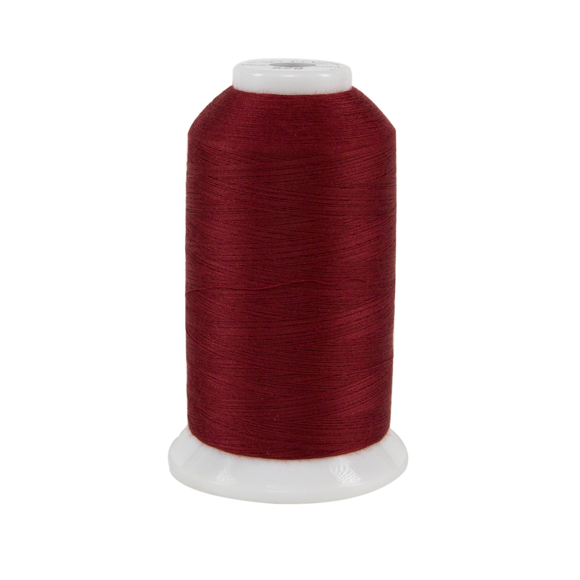 Spool of red thread on a white background