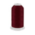 Spool of dark red thread on a white background