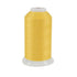 Spool of yellow thread on a white background