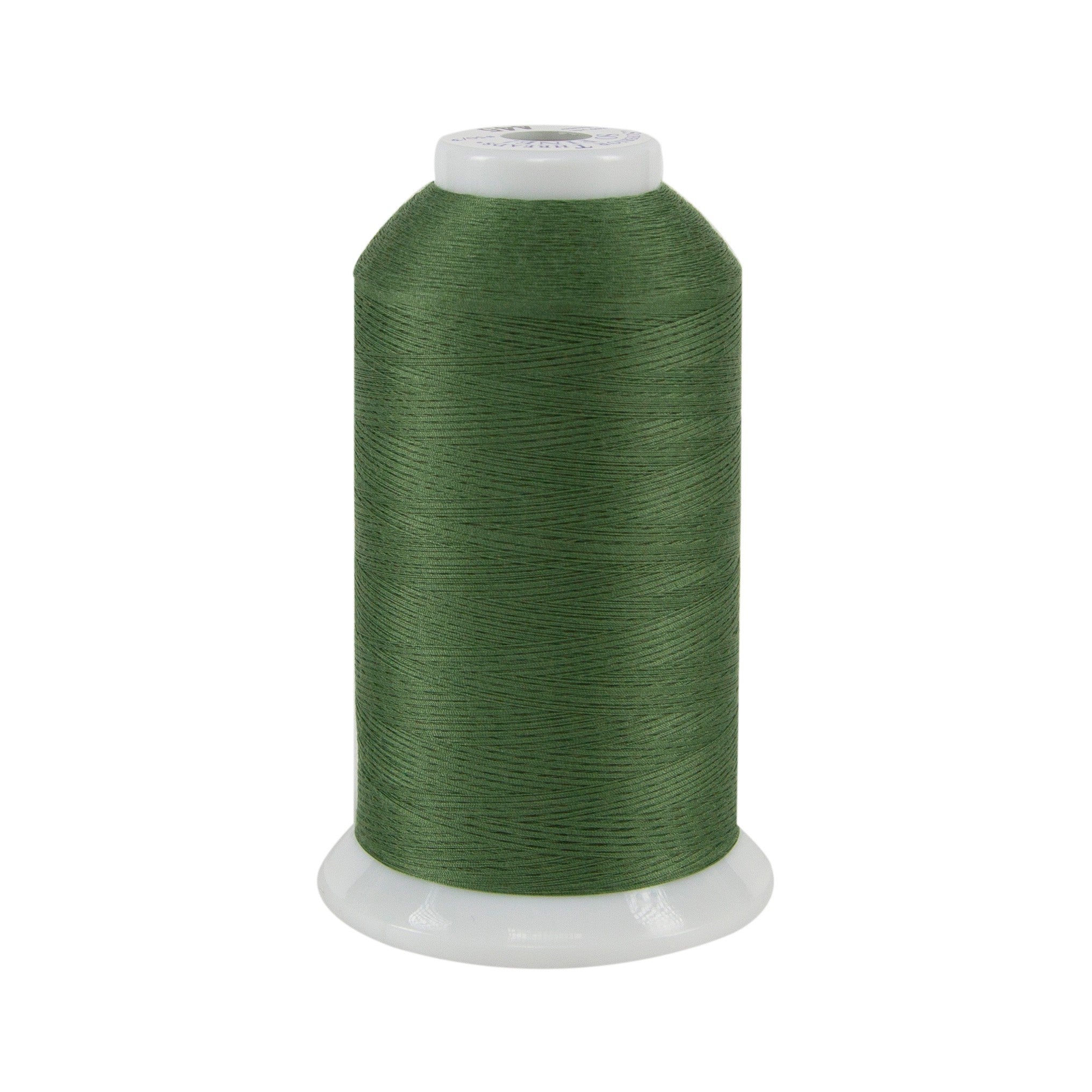 Spool of green thread on a white background