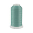 Spool of teal thread on a white background