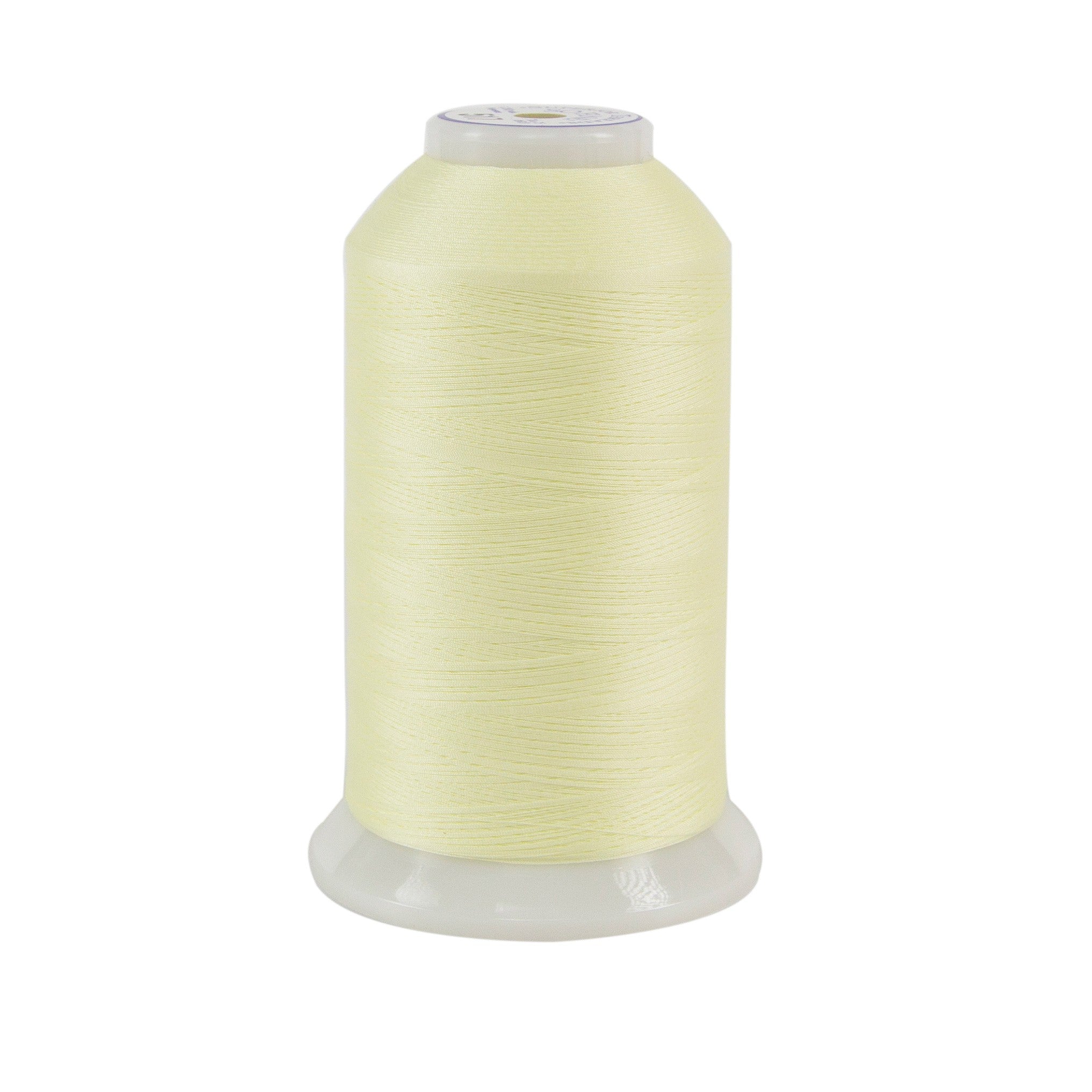Spool of pale yellow thread on a white background