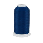 Spool of blue thread on a white background