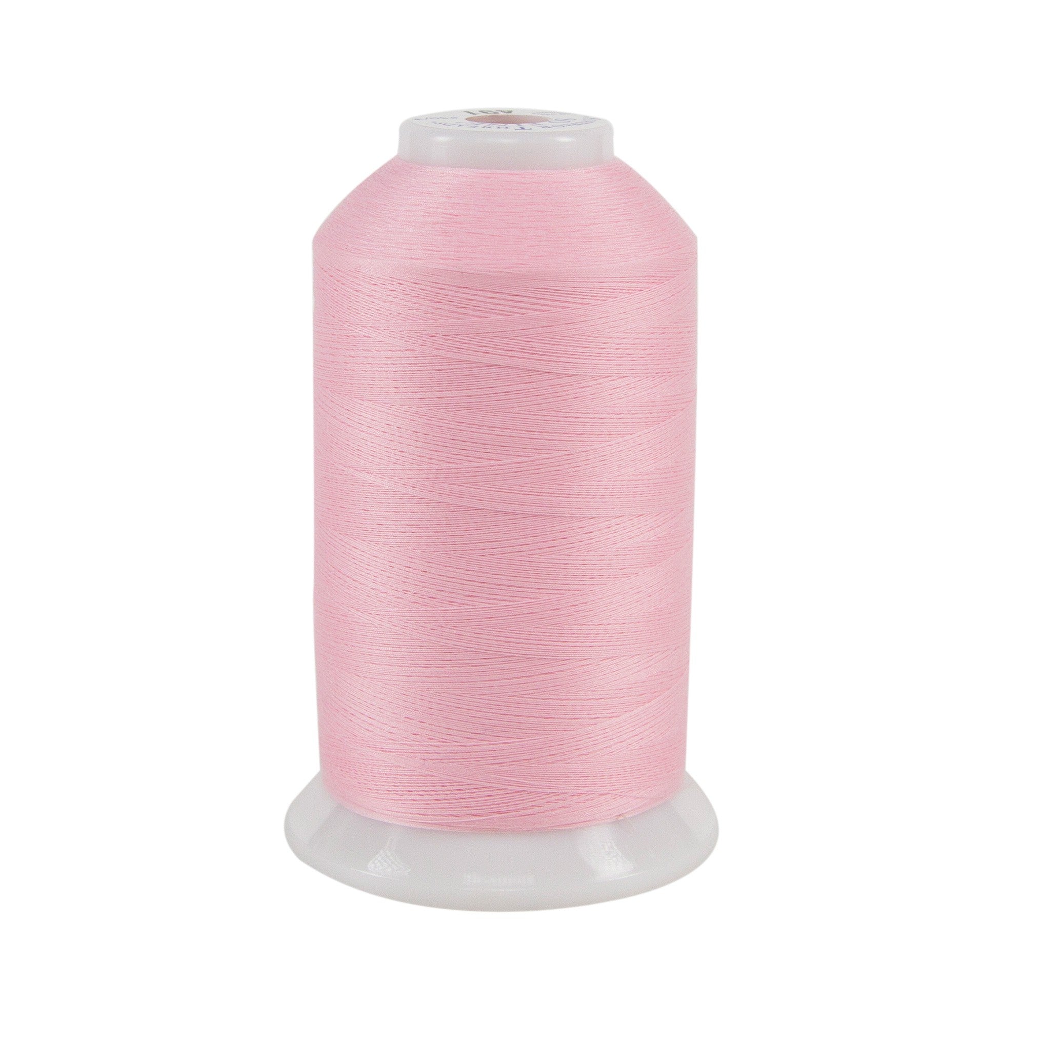 Spool of pink thread on a white background