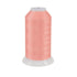 Spool of pink thread on a white background
