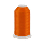 Spool of orange thread on a white background