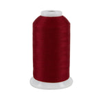 Spool of red thread on a white background