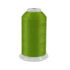 Spool of green thread on a white background