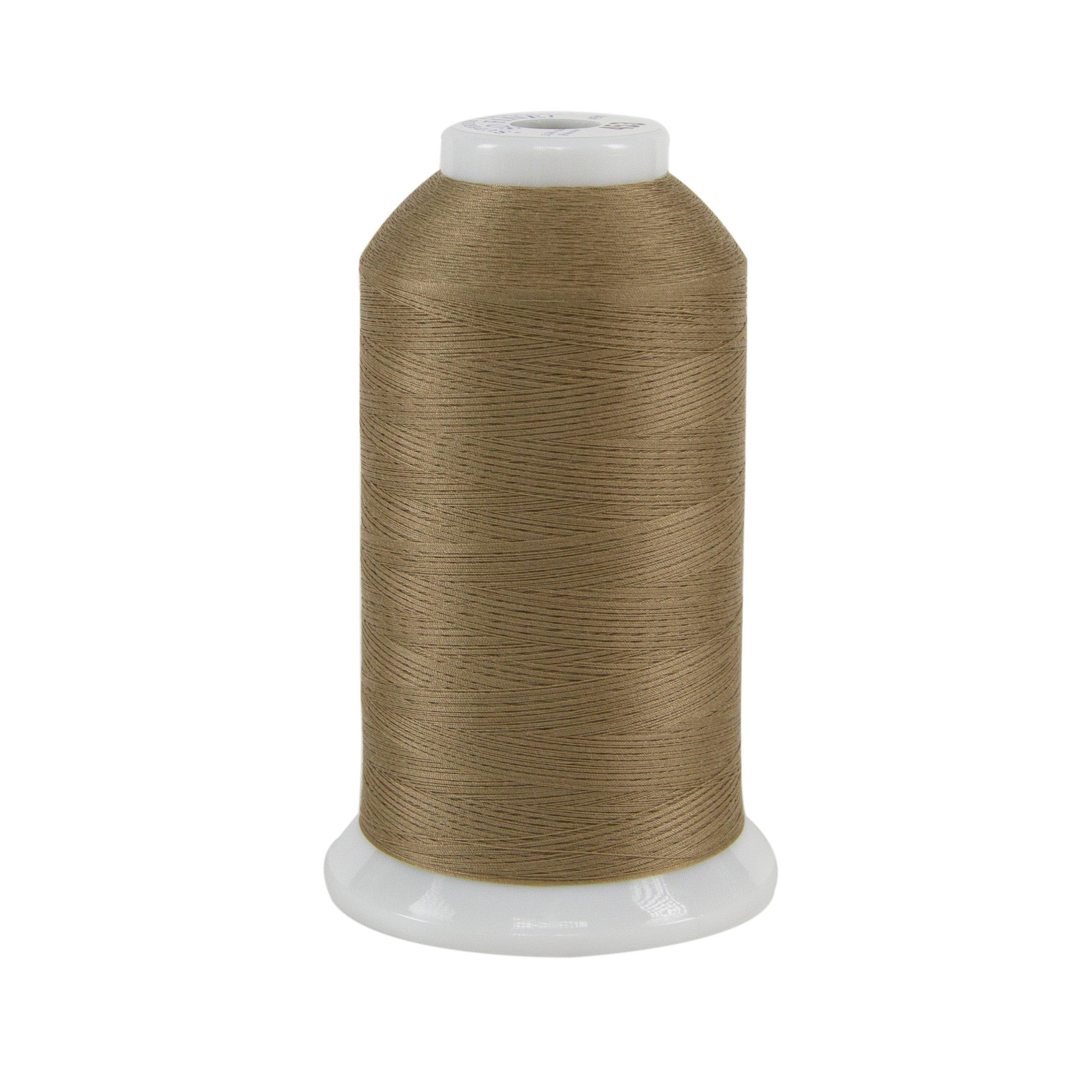 Spool of brown thread on a white background