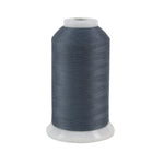 Spool of gray thread on a white background