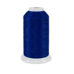 Spool of blue thread on a white background