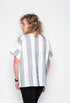 Woman wearing a black and white striped shirt against a white background