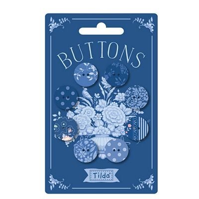 Packaging of decorative buttons with floral and animal designs on a blue background
