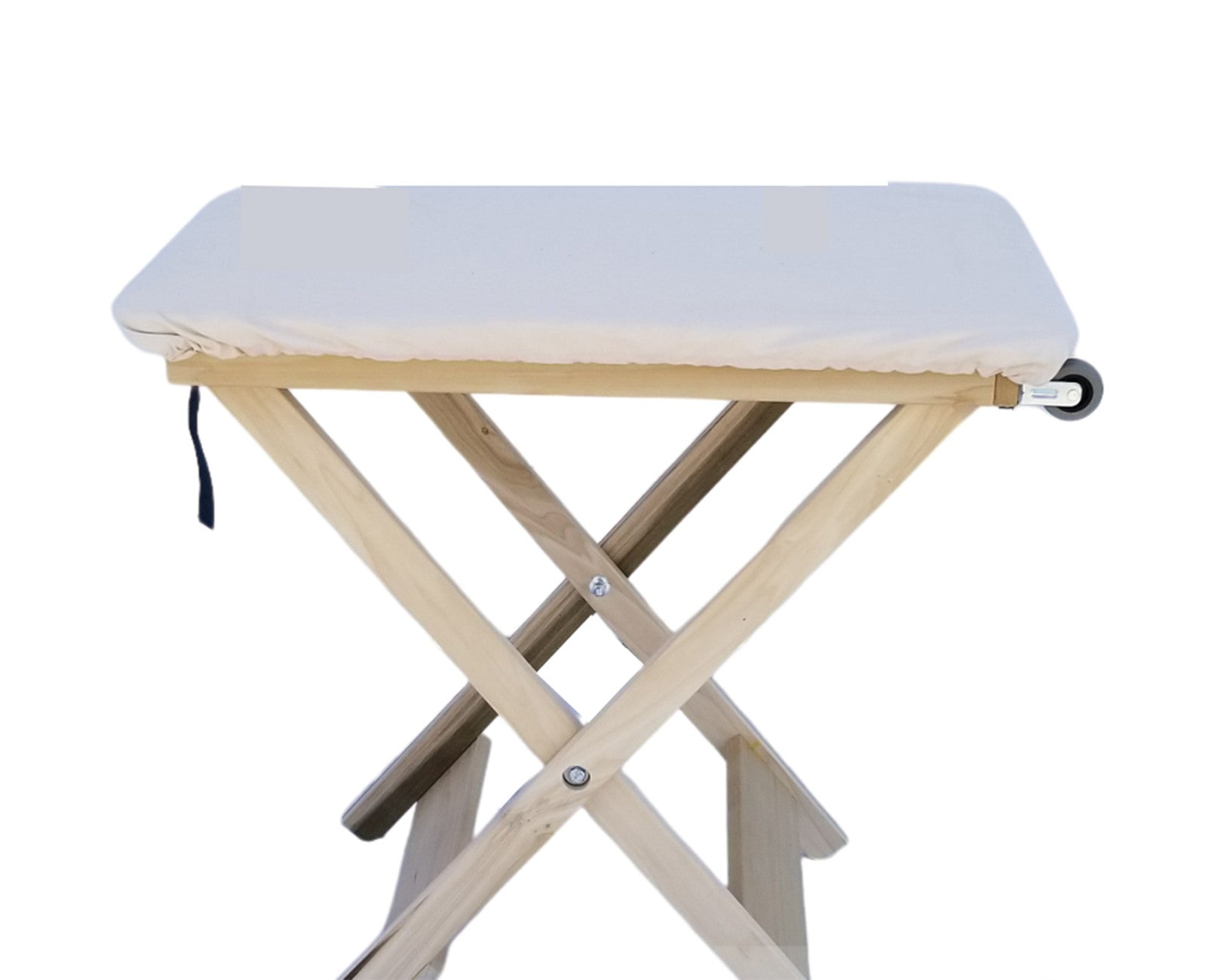 A light natural wood folding table with a thick, off-white cushioned pad, shown on a solid white background.