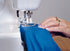 Janome CoverPro 900CPX Coverstitch Serger Machine close up being used