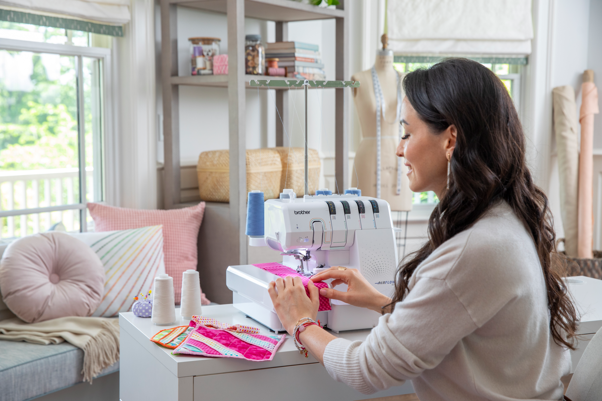 image of a woman using the Brother AIRFLOW 3000 Air Serger