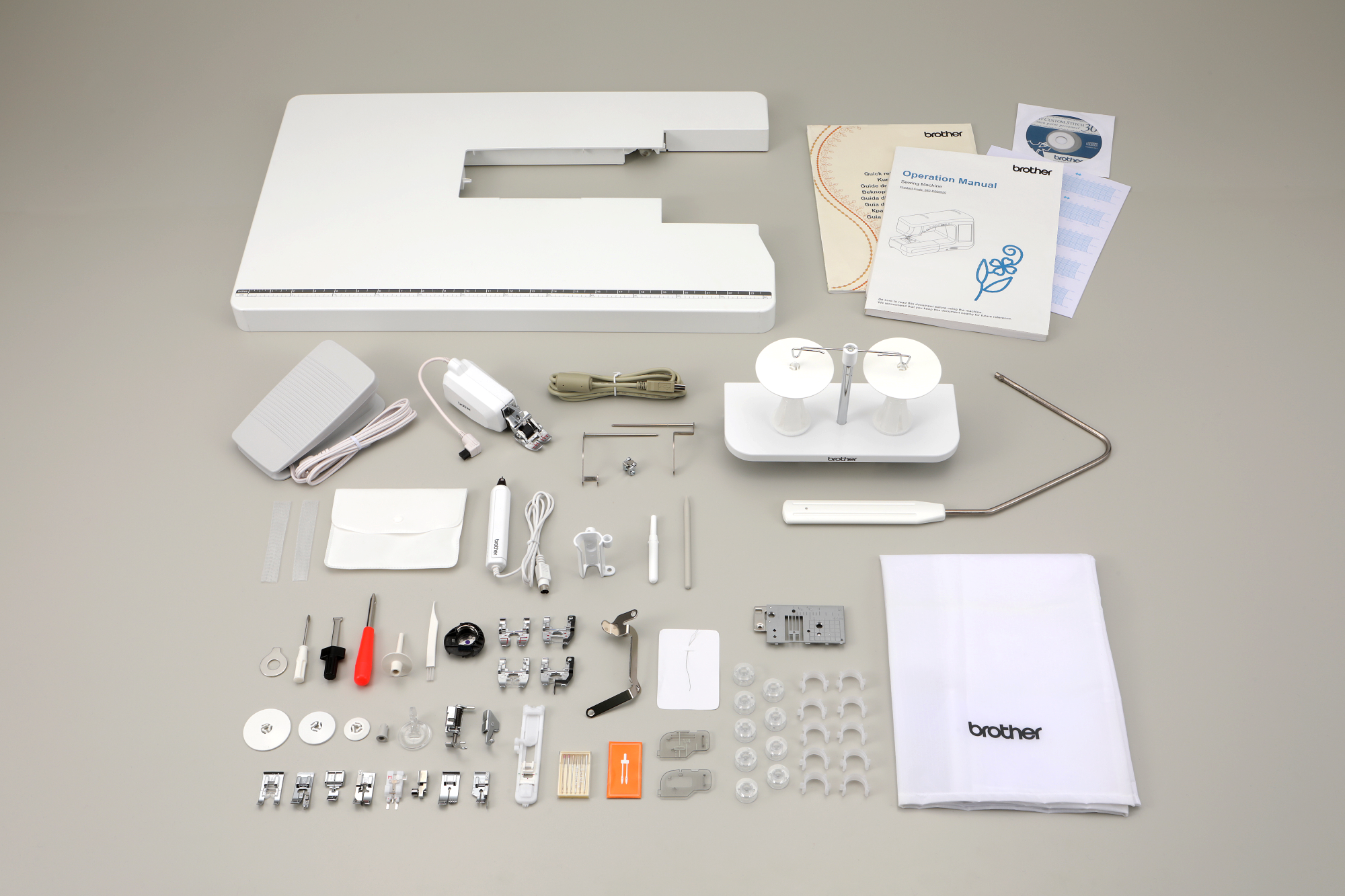 image of the accessories included with the Brother Innov-is BQ3100 eleven and a quarter inch Sewing and Quilting Machine 