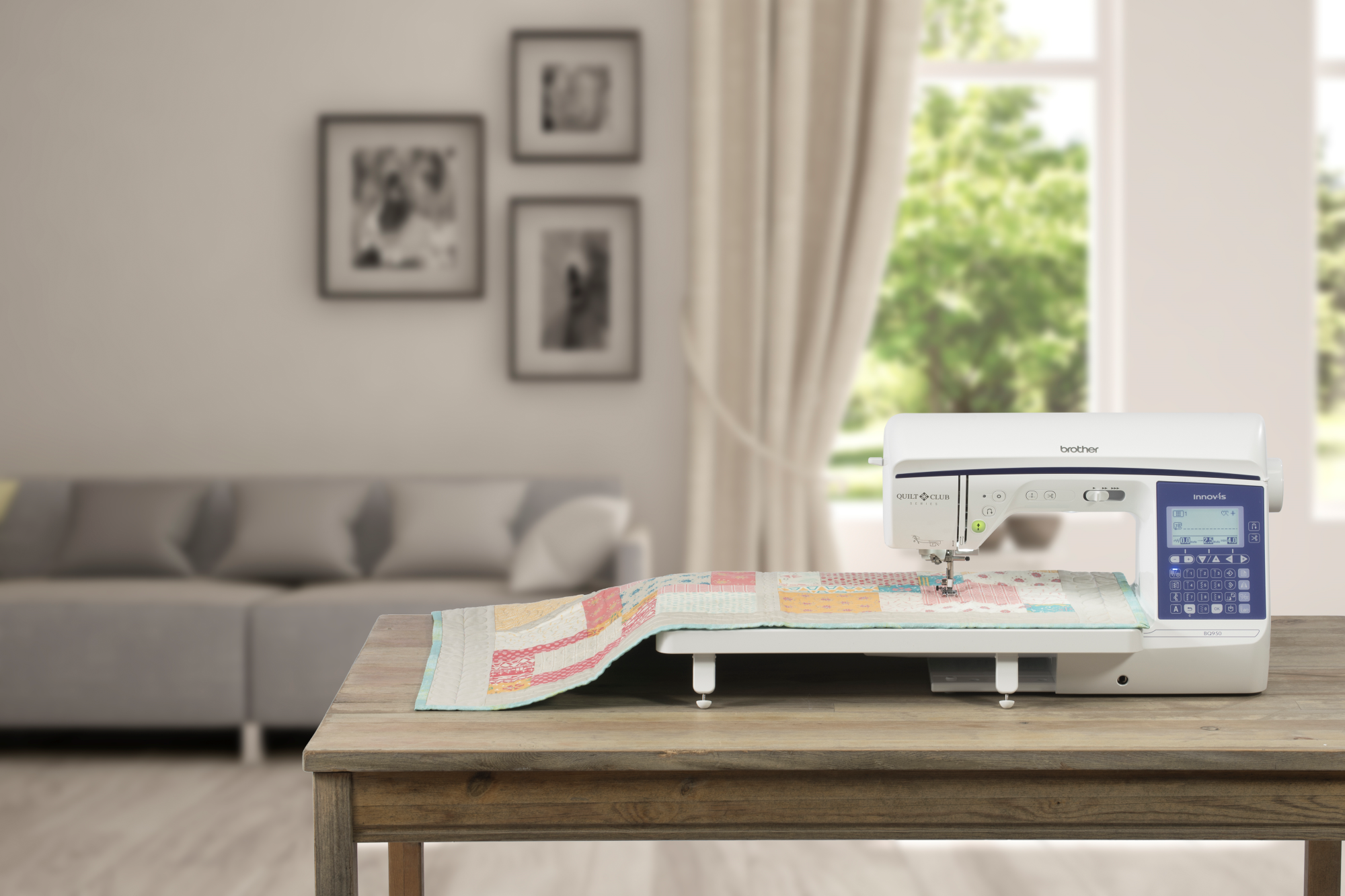 image of the Brother Innov-is eight point three by four point one BQ950 Sewing and Quilting Machine on a table with an example item