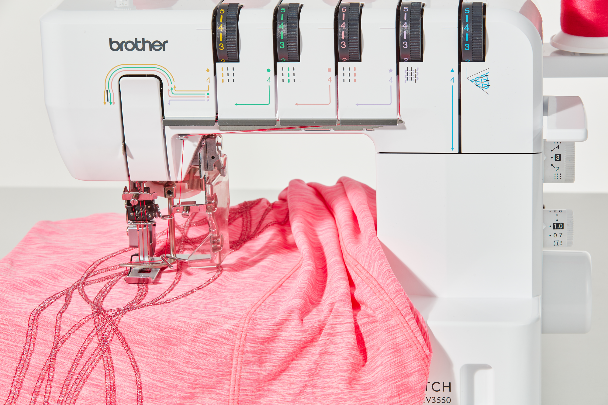 image showcasing the Brother CV3550 six point one by three point nine Double-Sided Cover Stitch Machine in action, sewing a shirt