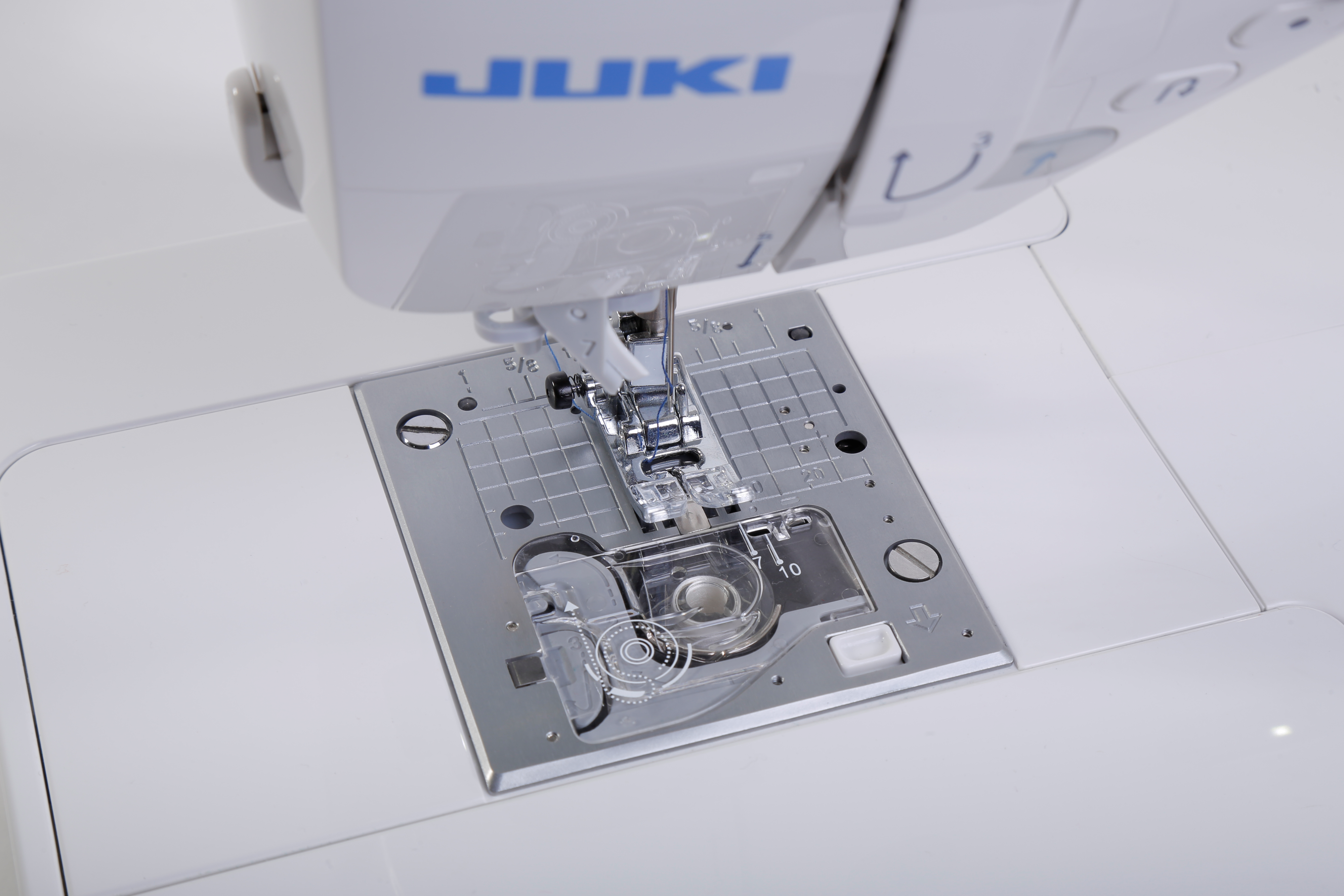 close up image of the JUKI DX-2000QVP Sewing and Quilting Machine needle plate
