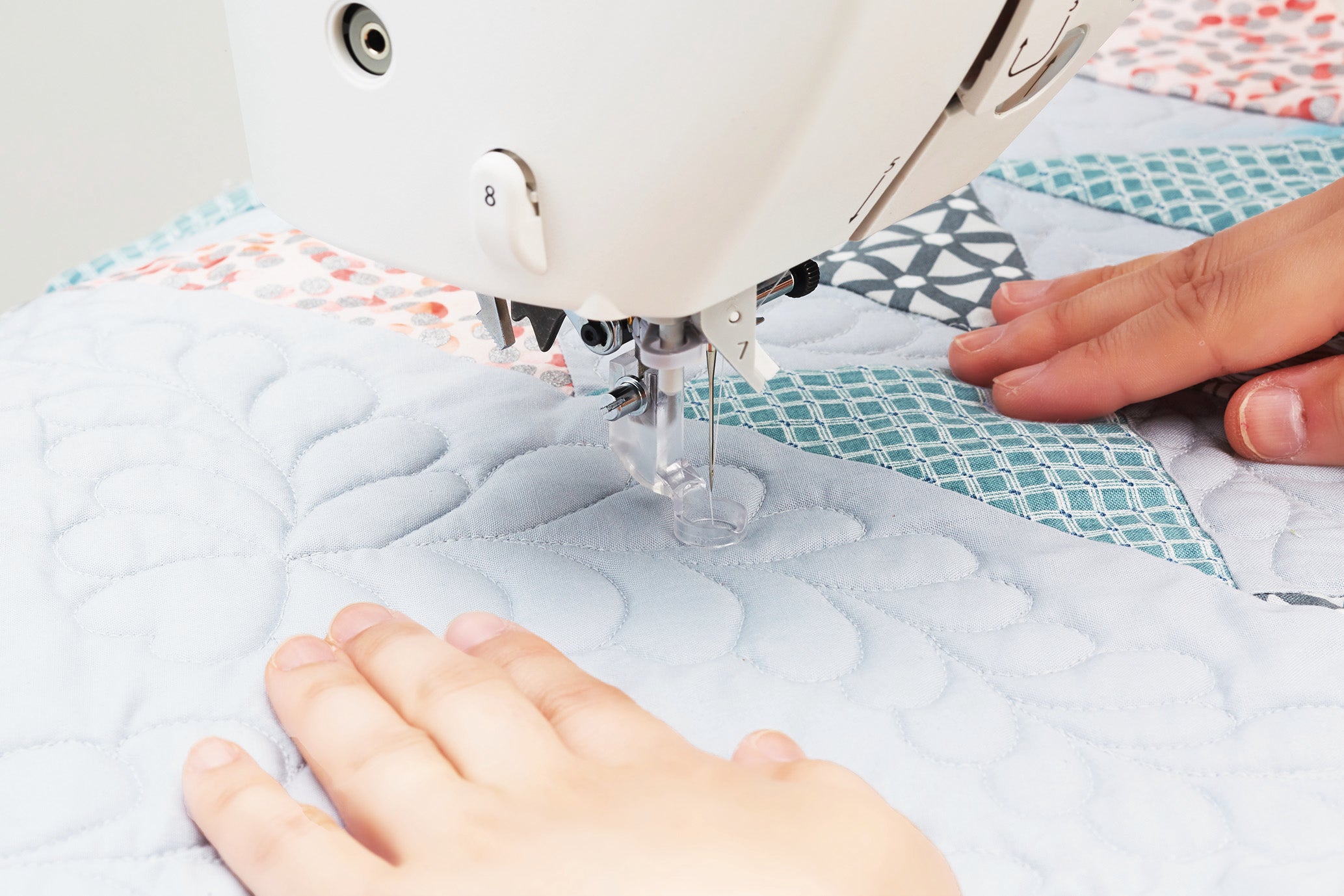 close up image of the JUKI HZL-NX7 Kirei Professional Quality Sewing and Quilting Machine being used to sew an item