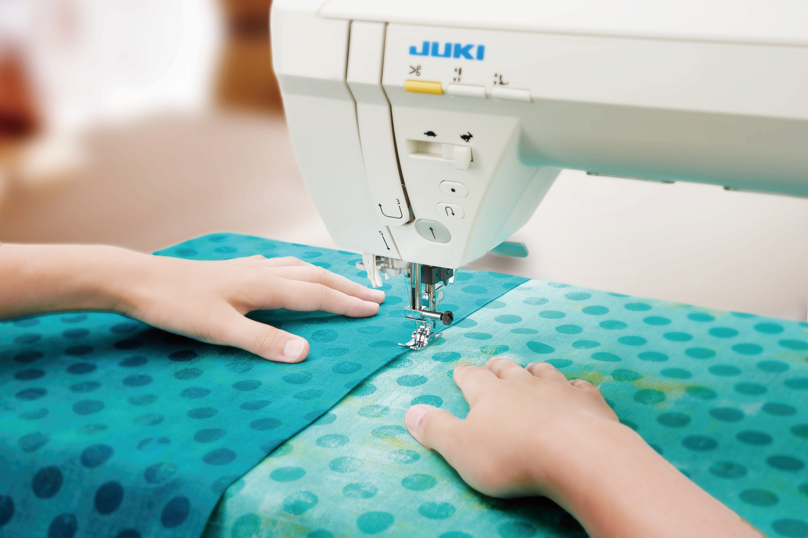 close up image of the JUKI HZL-NX7 Kirei Professional Quality Sewing and Quilting Machine being used to sew an item