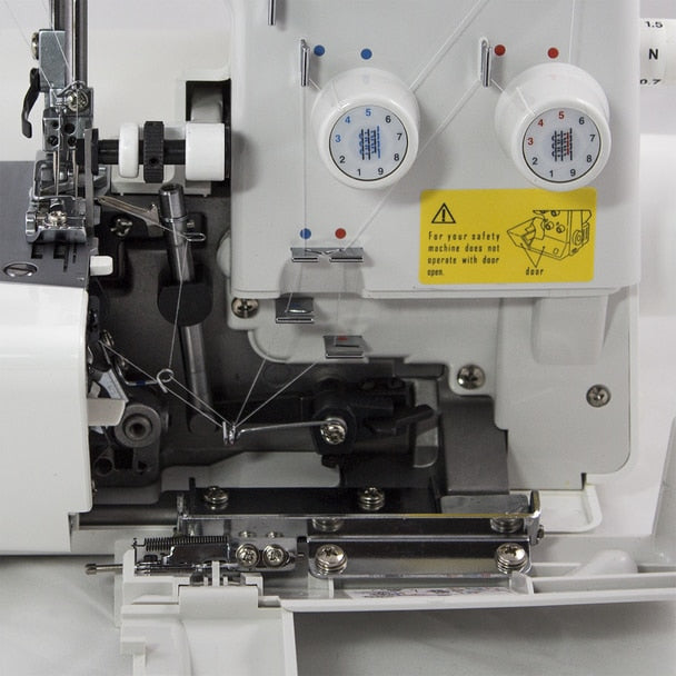 JUKI MO-654DE 2/3/4 Thread Overlock Serger Sewing Machine close up view of needle inside of the machine