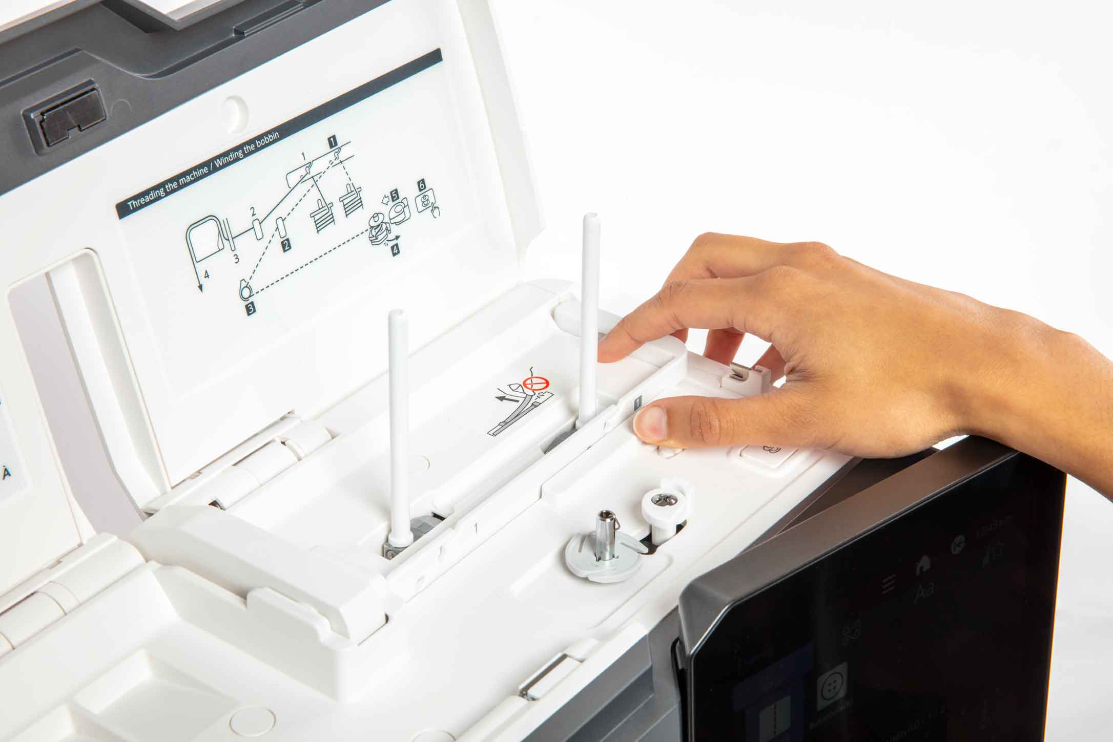 image of the Janome Continental M17 Sewing and Embroidery Machine being worked on