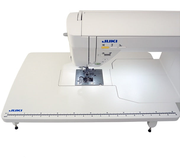 image of the JUKI HZL-NX7 Kirei Professional Quality Sewing and Quilting Machine with a wide table attachment