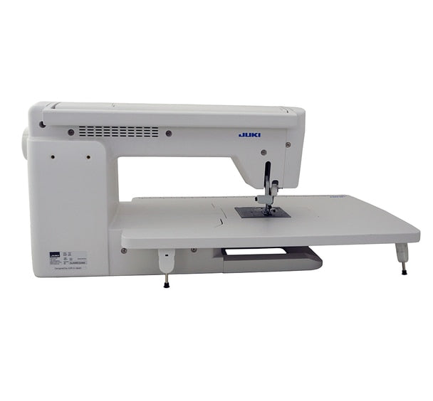 back facing image of the JUKI HZL-NX7 Kirei Professional Quality Sewing and Quilting Machine with wide table attached