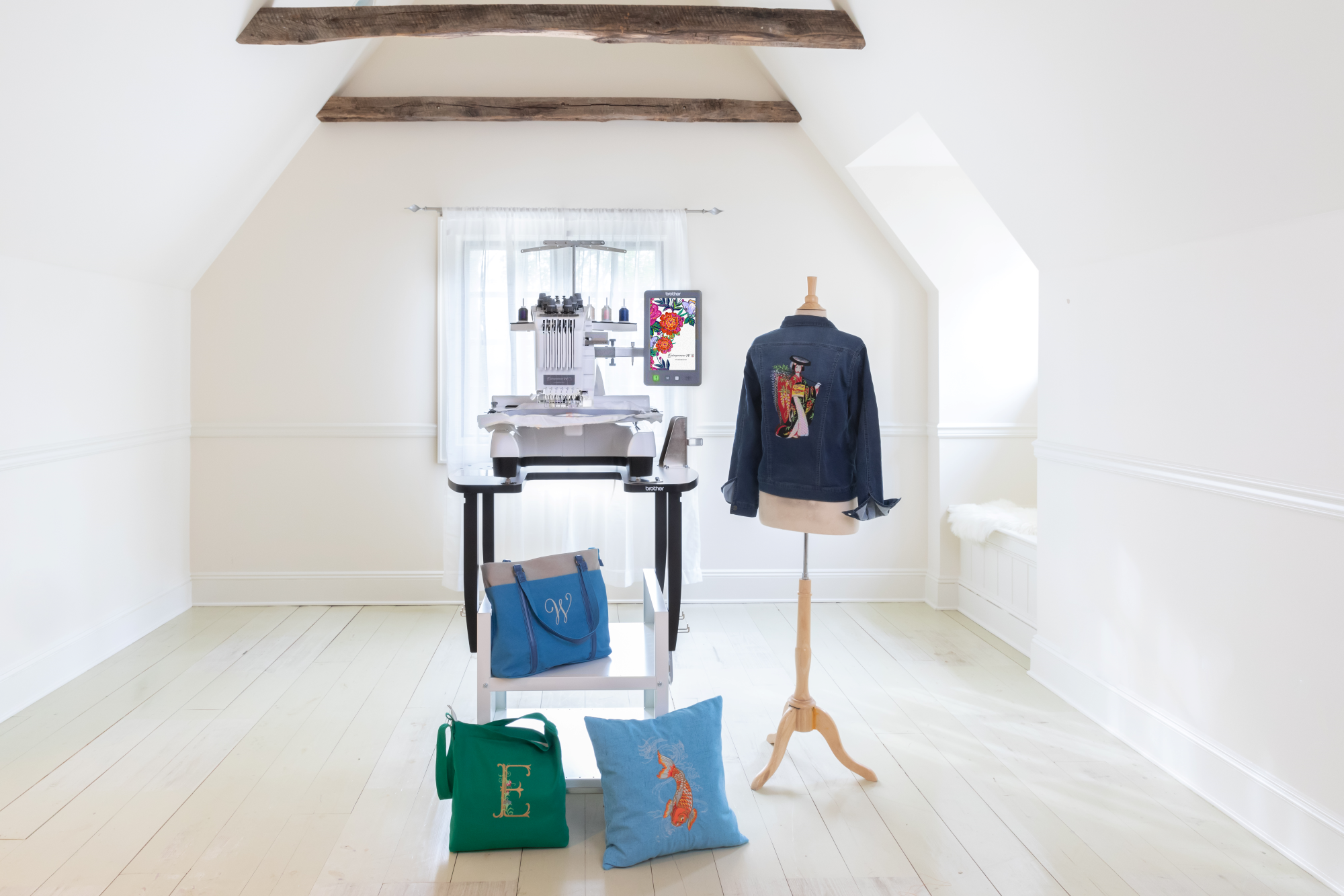 image of the Brother Entrepeneur W PR680W twelve by eight six needle embroidery machine with an example shirt, example pillow, and two example bags