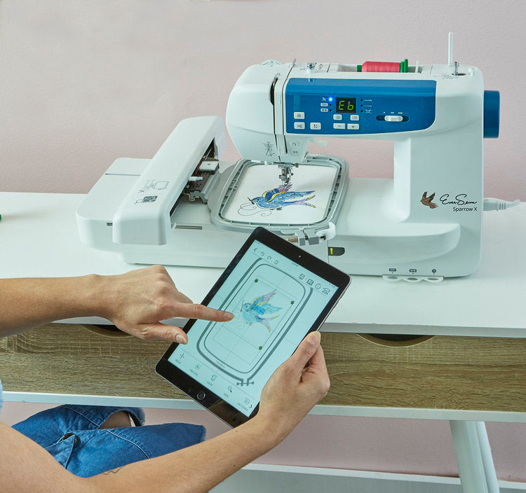 image of a woman connecting to the EverSewn Sparrow X2 Sewing and Embroidery Combo Machine via tablet