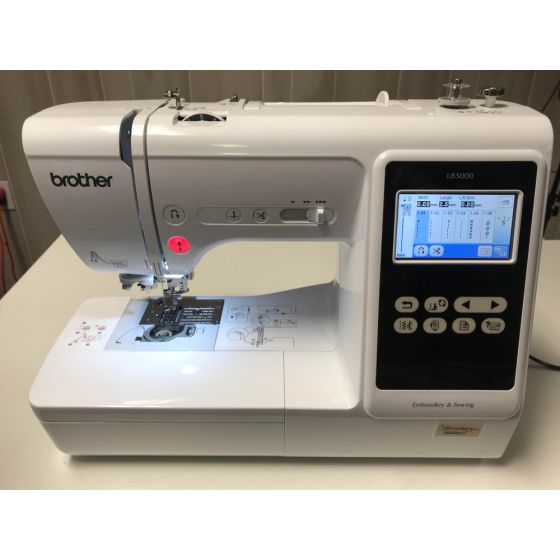 front facing image of the Brother LB5000 Sewing and Embroidery Machine Refurbished on a table