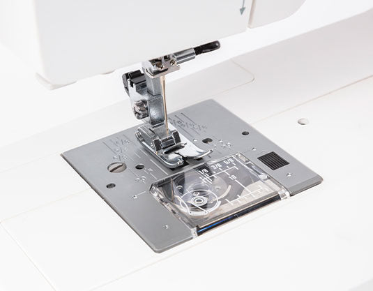 close up image of the Janome Sewist S709 Sewing Machine needle plate